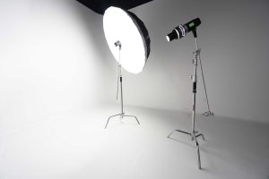 photography studio space with two tripods and two studio lights on them